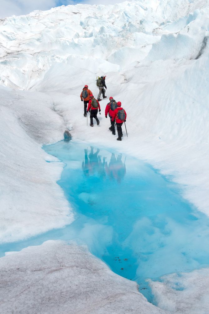 People hiking through the Mendenhall Glacier