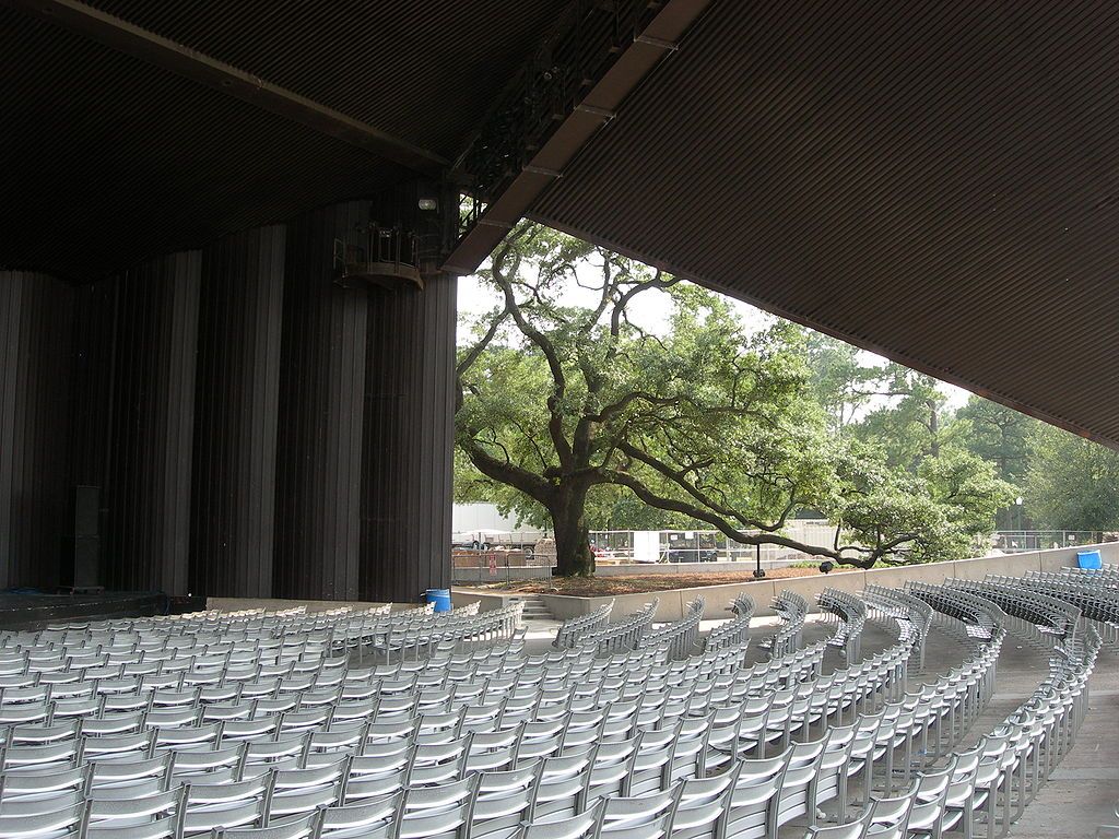 Empty white chairs lined perfectly at Miller Outdoor Theater