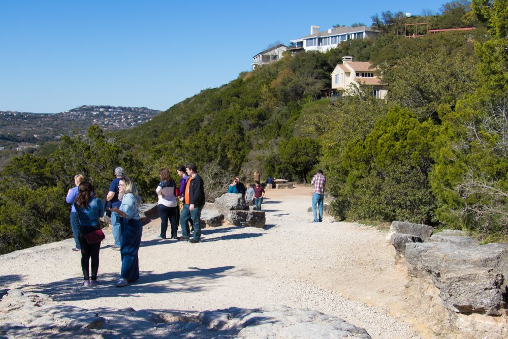 Visitors hiking Mount Bonnell