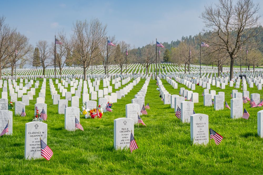Perfectly aligned white tombstones at Mount Moriah Cemetery