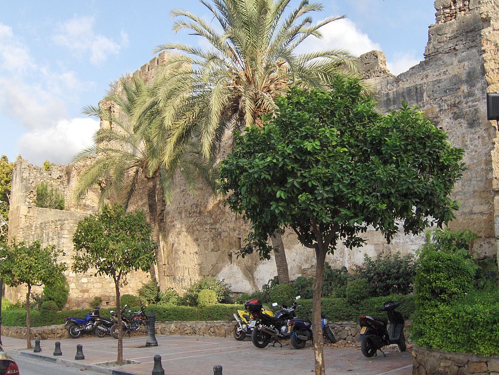 Motorcycles parked outside Murallas Del Castillo