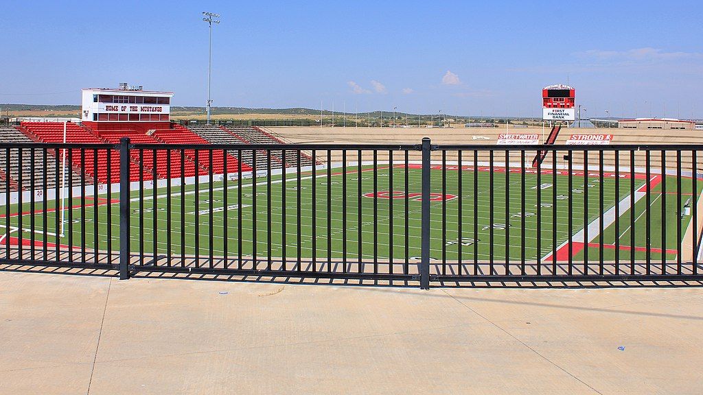 Empty football stadium in broad daylight.