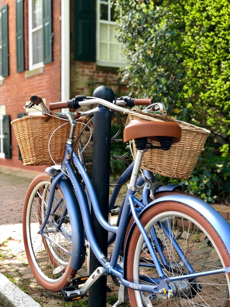 A bike with wooden baskets