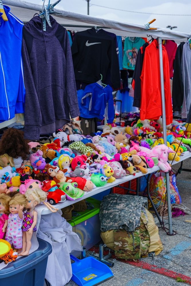 Toys and dress kept for sale at the outdoor flea market at New Castle Farmers Market
