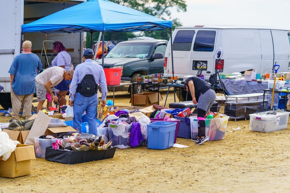 Visitors checking out goodies from the flea market at New Castle Farmers Market
