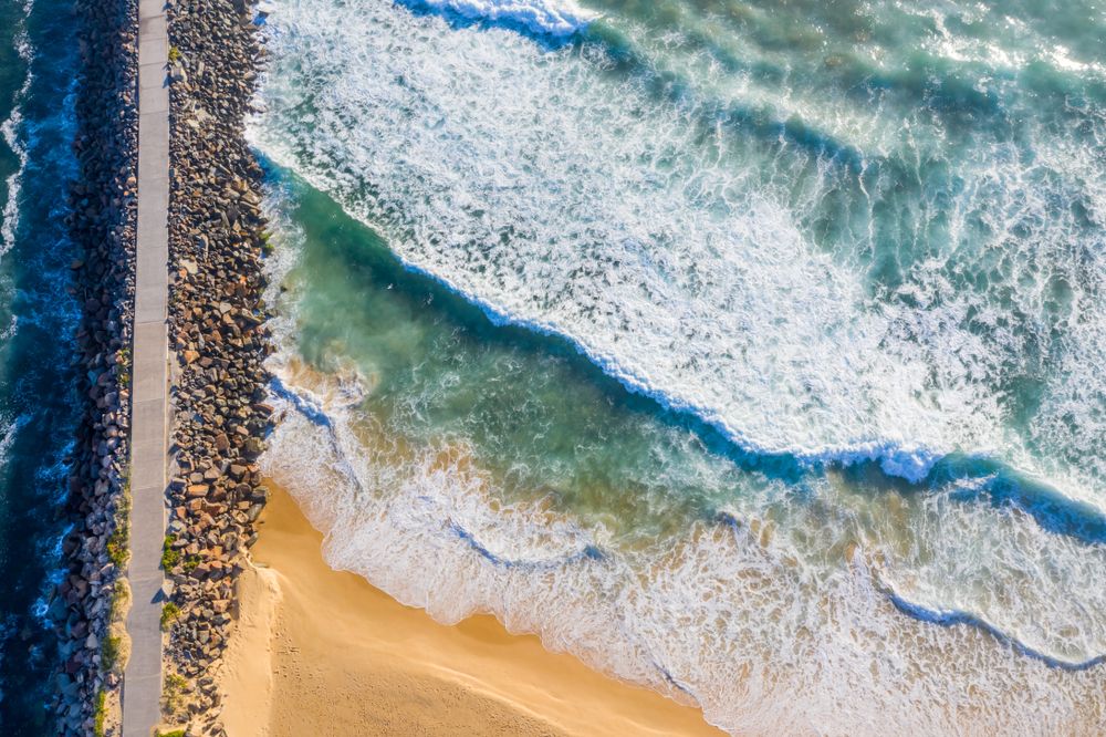 Waves craching against the rocks at Newcastle Breakwater
