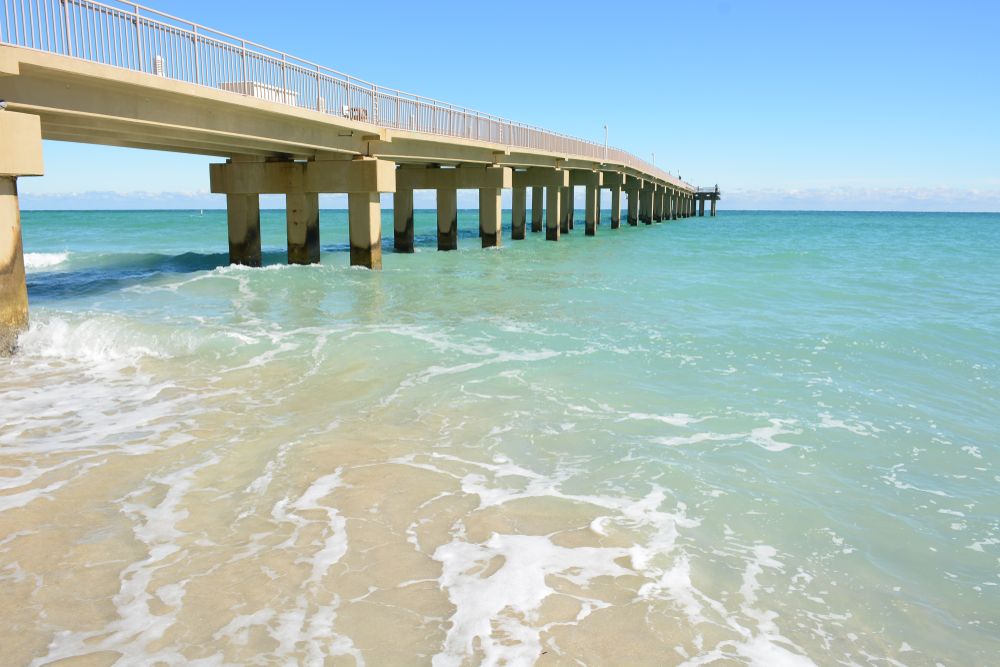 Newport Fishing Pier surrounded by blue ocean