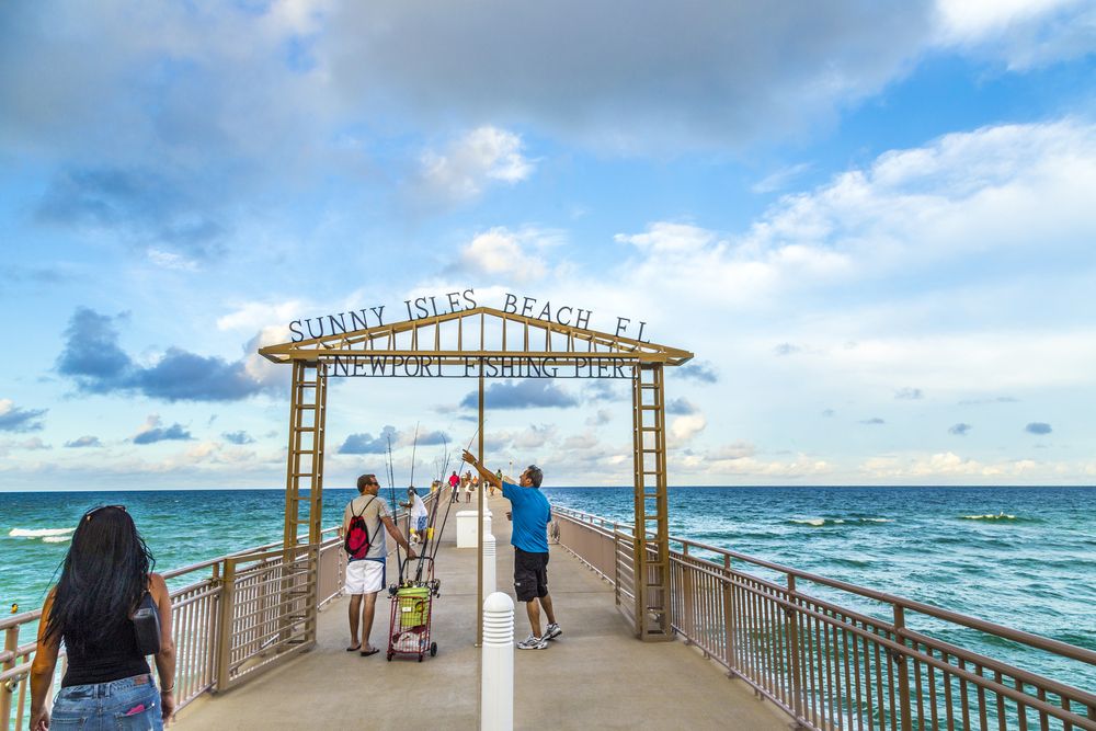 Tourists fishing at Newport Fishing Pier