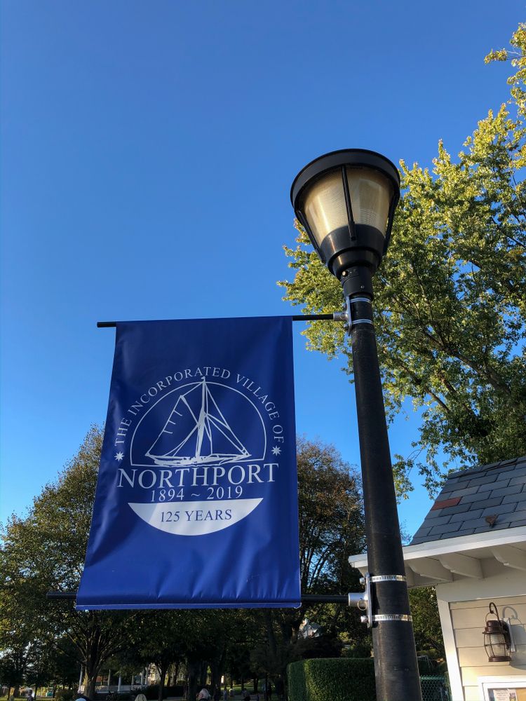 Blue banner on a lightpost at Northport Village Park