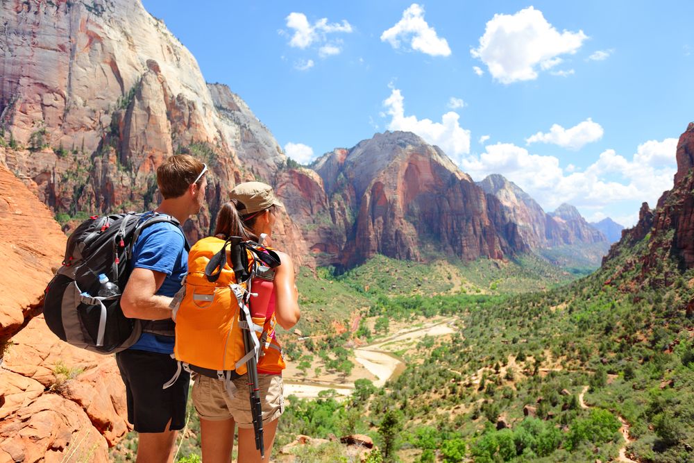 A young couple enjoying the view from Observation Point
