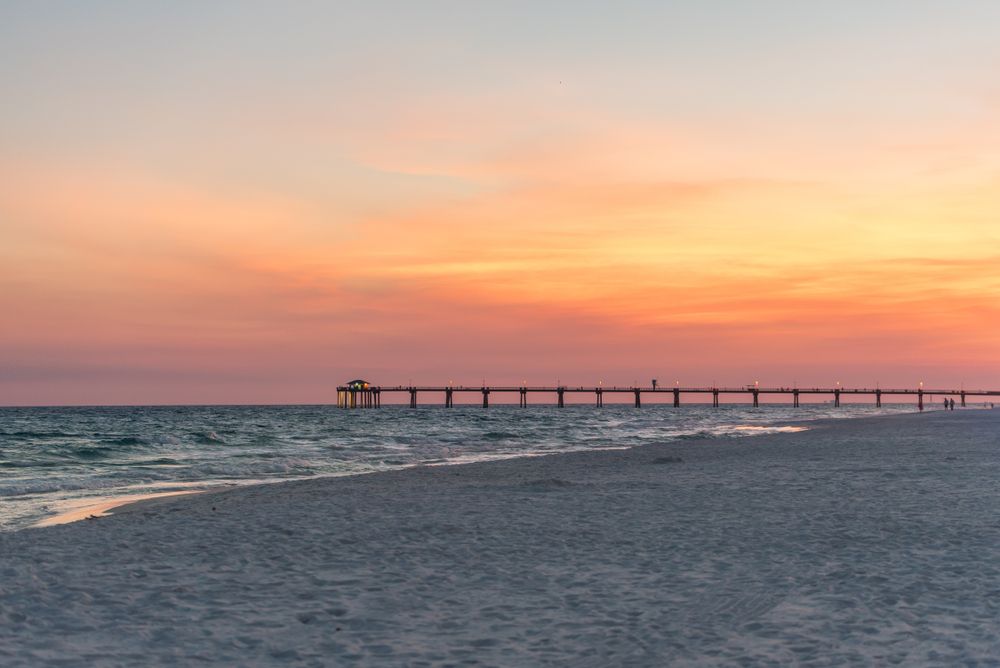 Sunset and a far view of the Okaloosa Island Fishing Pier.
