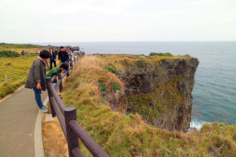 People admiring Cape Manzamo