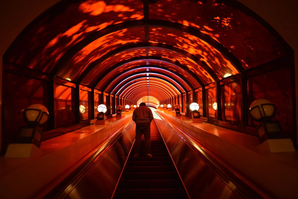 An underground escalator leading to Okinawa World's cave