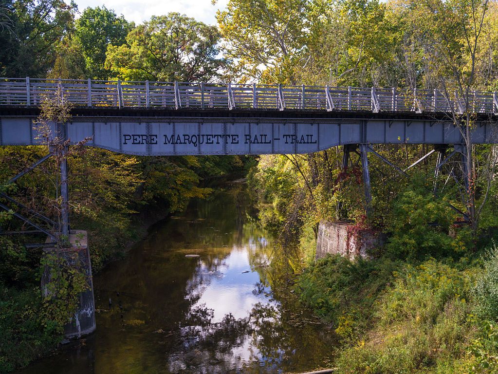 Name sign of Pere Marquette Rail Trail on the bridge