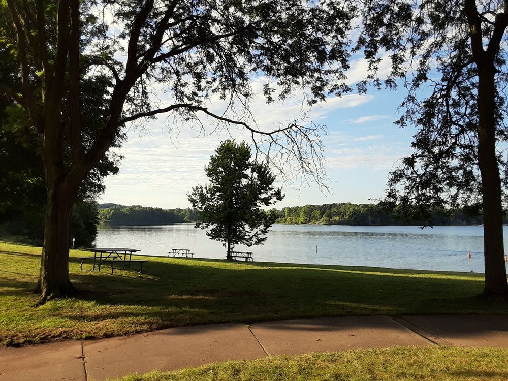 Calm lake and picnic area at Pinckney State Recreation Area