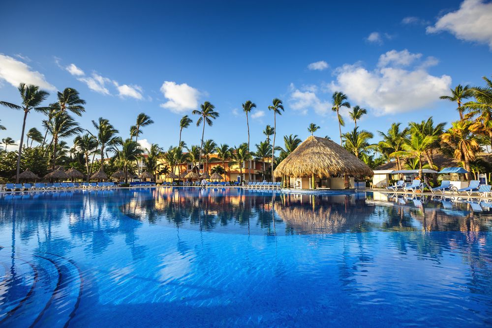 Luxurious resort with pool and hut shaped rooms at Punta Cana