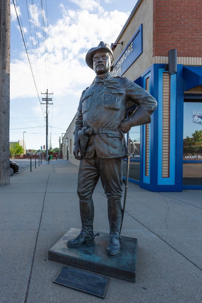 A standing bronze sculpture of a president at Rapid City