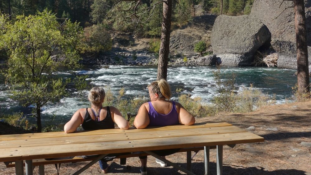 Two women relaxing after a hike at Riverside State Park