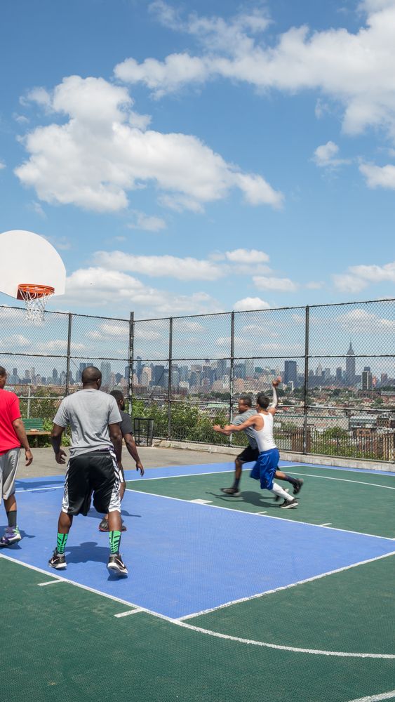 Men playing Basketball at Riverview Fisk Park