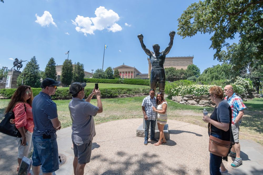 Visitors posing infront of the Rocky Statue