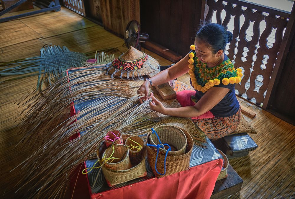 Women weaving bamboo at Sarawak Cultural Village