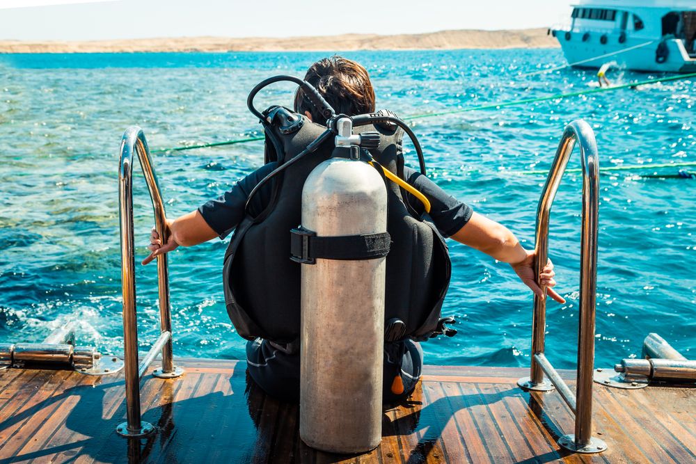 A man with Scuba Diving equipment at Kefalonia