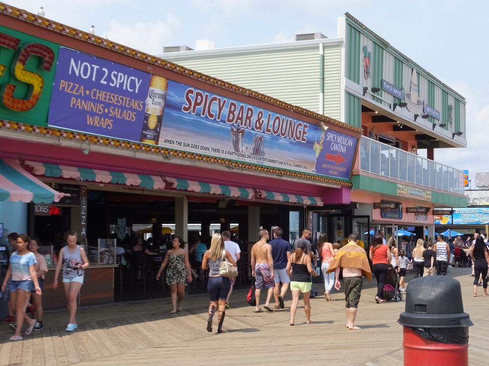 People walking around Seaside Heights Boardwalk