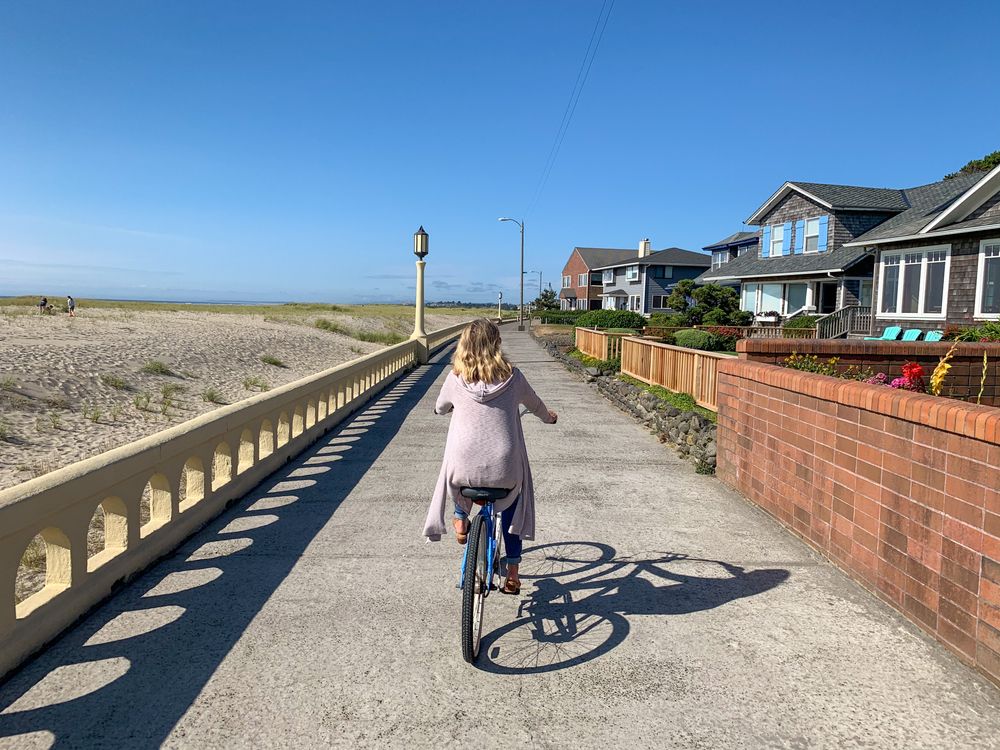 A person riding a bike along Seaside Promenade