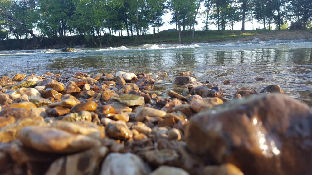 Rocky shore of Siloam Springs Kayak Park