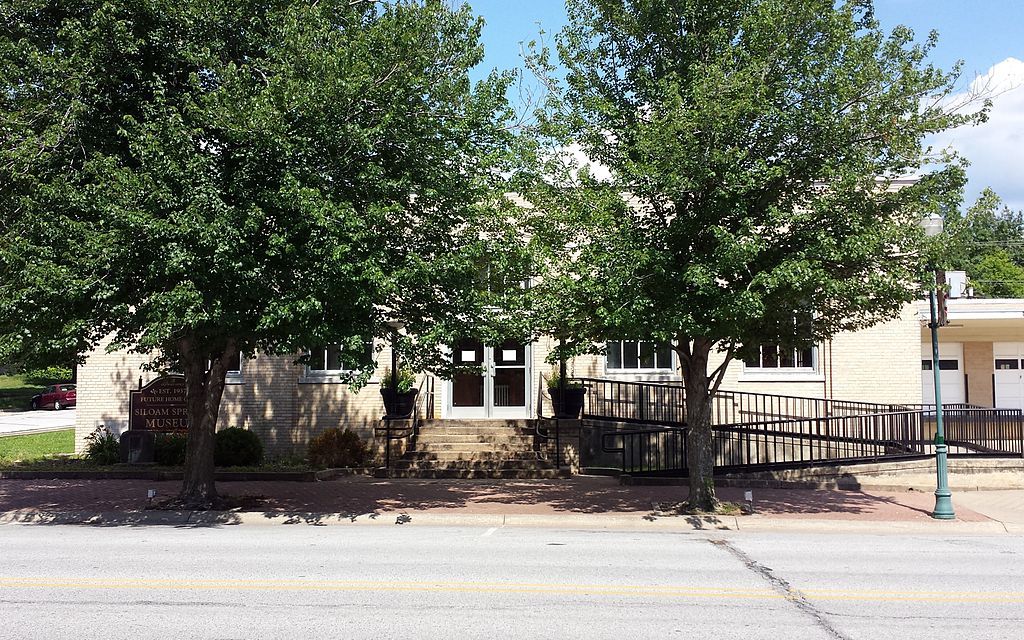 Trees covering the exterior of Siloam Springs Museum