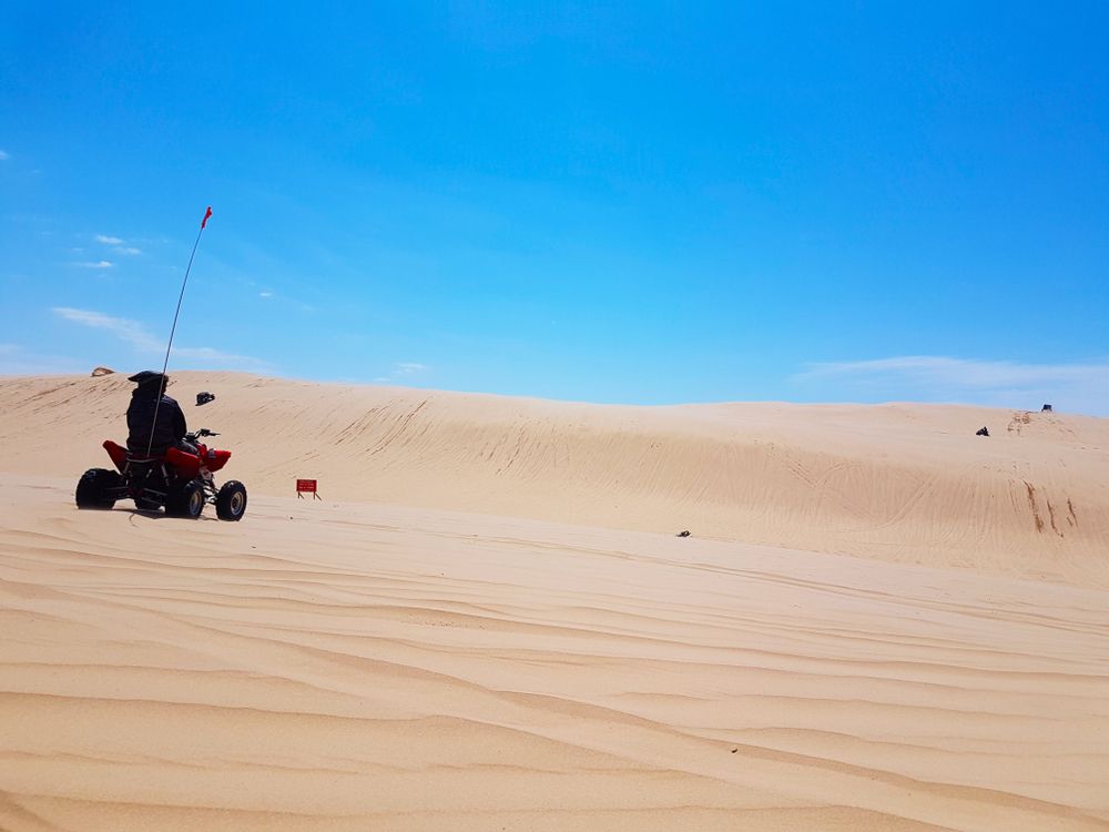 People riding quad bikes in Silver Lake Sand Dunes