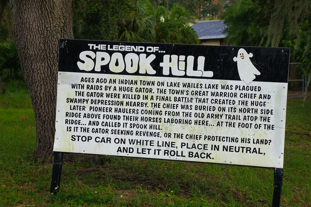 Spook Hill sign post explaining the legend