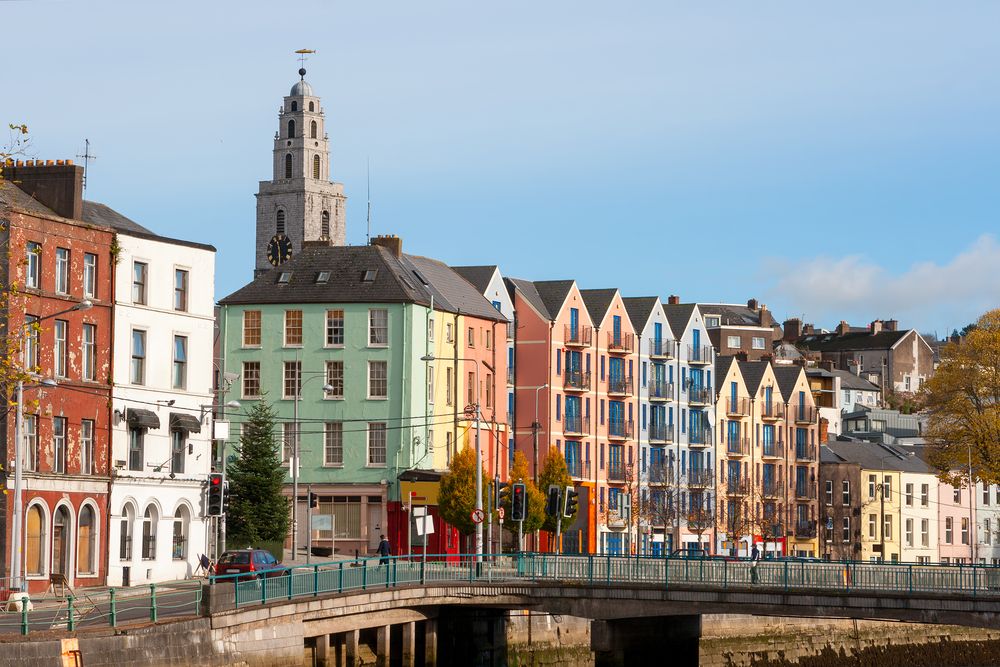 Pastel colored houses lined up at St. Patrick's quay