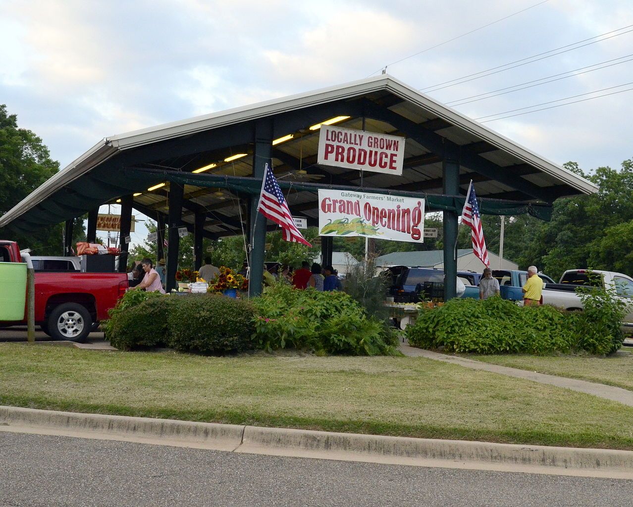 People looking at the flowers, fruits and vegetables at Texarkana’s Farmers Market