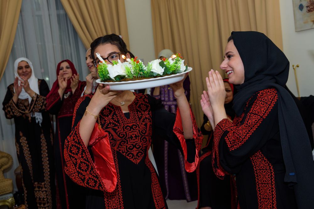 Women serving traditional arabian food in Abu Dhabi