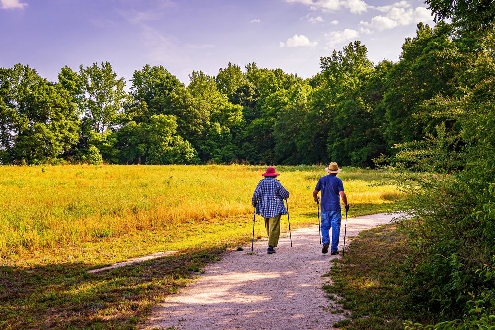 An old couple hiking at Turnipseed Nature Preserve