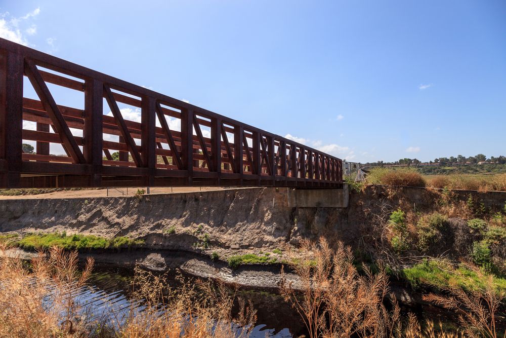 A narrow wooden bridge at Upper Newport Bay Nature Preserve