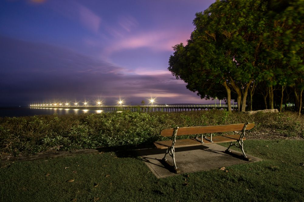 Wooden bench overlooking Urangan Pier