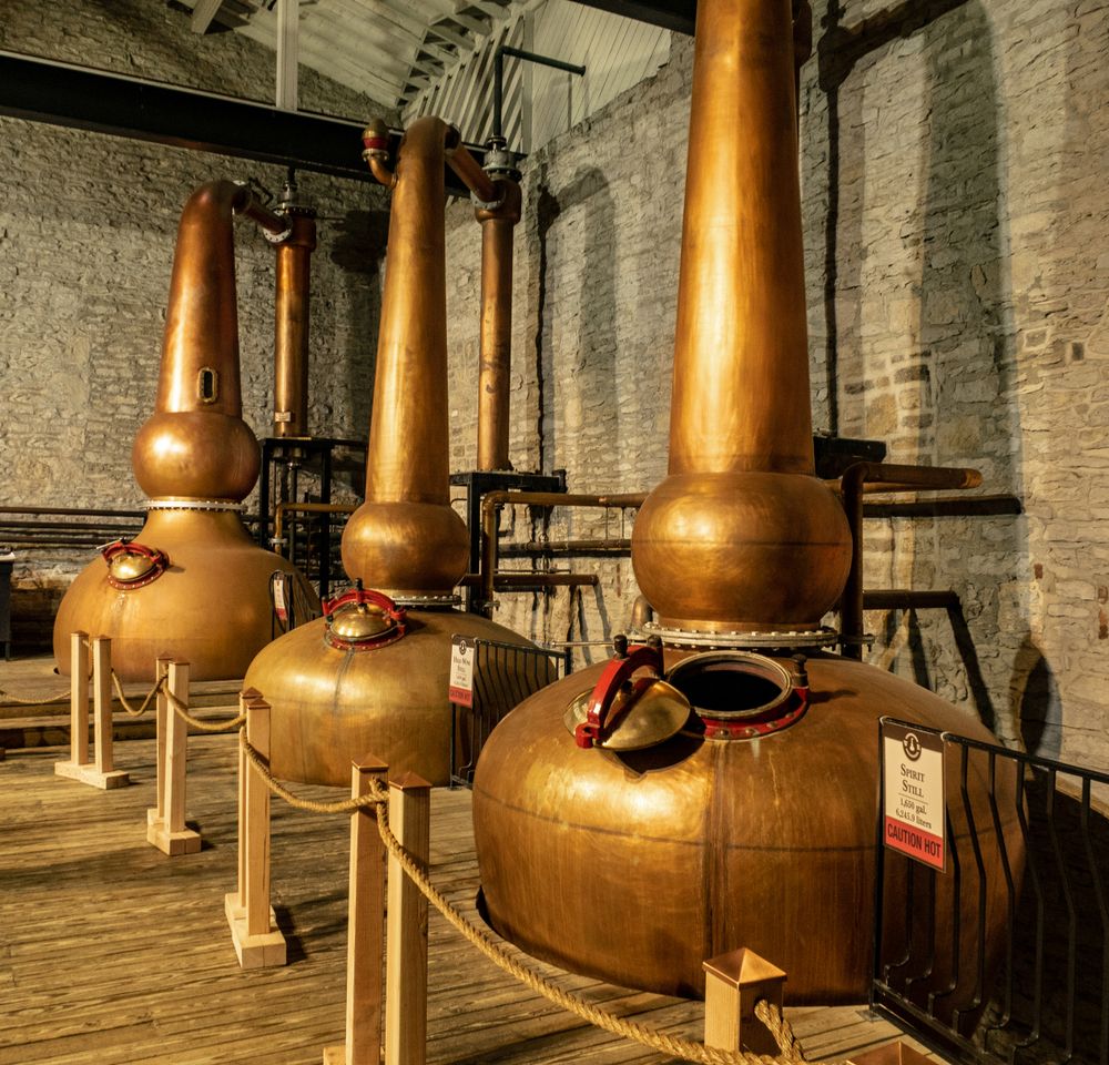 Three copper spirit still used to produce bourbon in Woodford Reserve Distillery