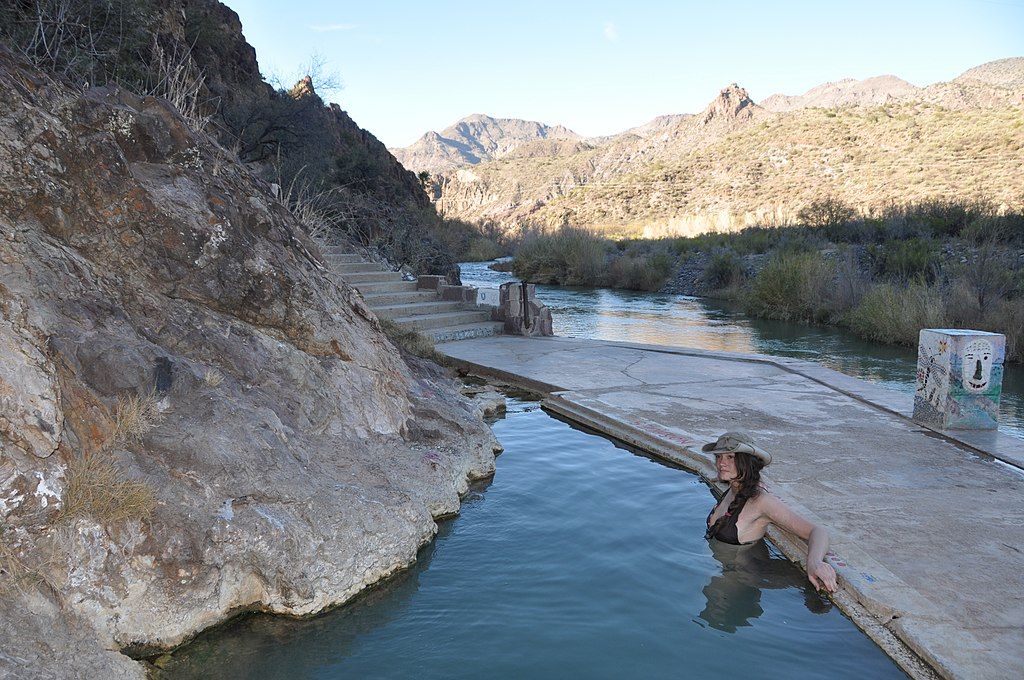 A woman swimming at Verde Hot Springs