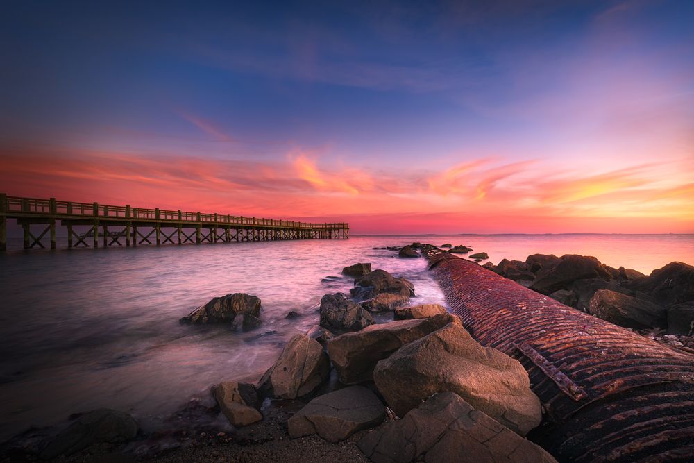 Beautiful twilight scenery at Walnut Beach with pier in the background