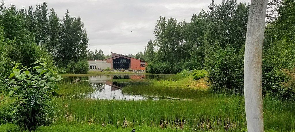 View of Alaska Native Heritage Center from across a lake