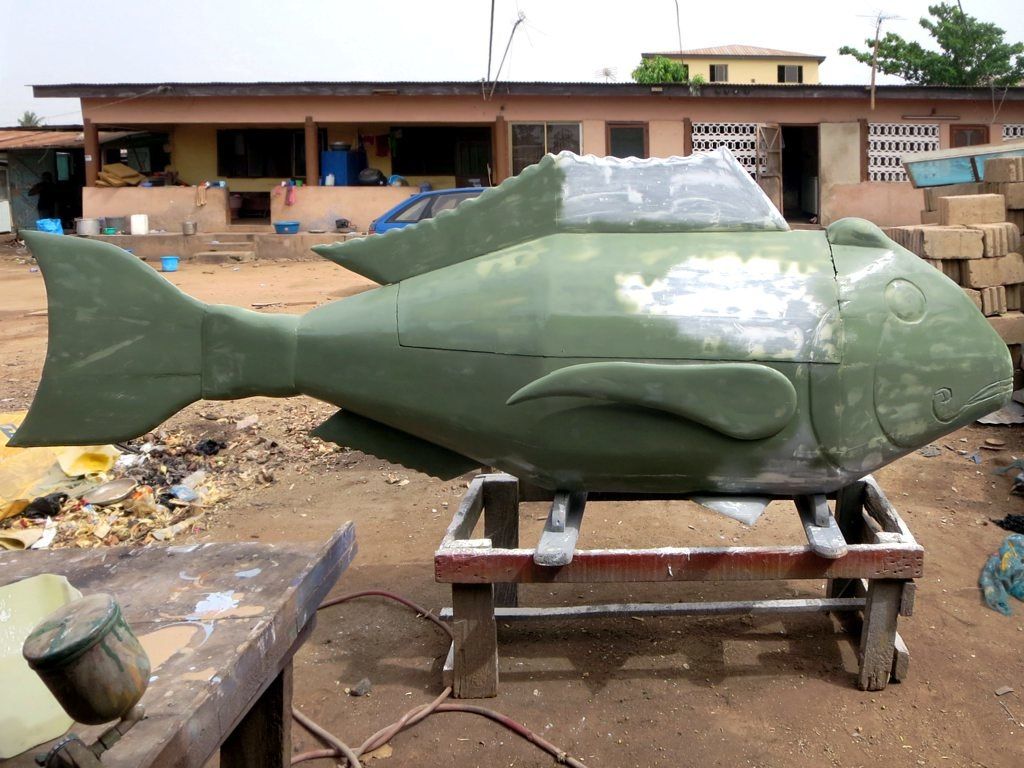 A fish-shaped coffin at Fantasy Coffin Workshop