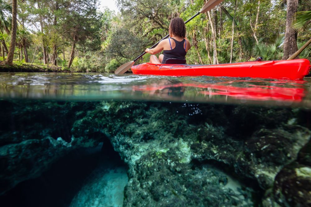 A Woman Kayaking at 7 Sisters Springs