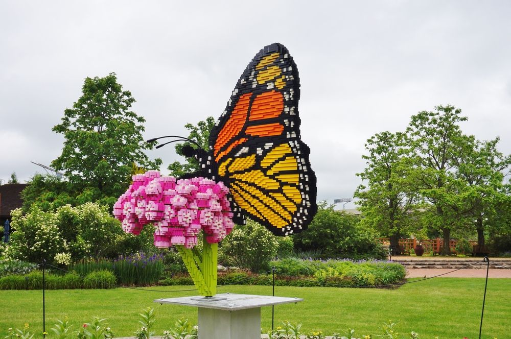 A large butterfly on a flower sculpture at Reiman Gardens