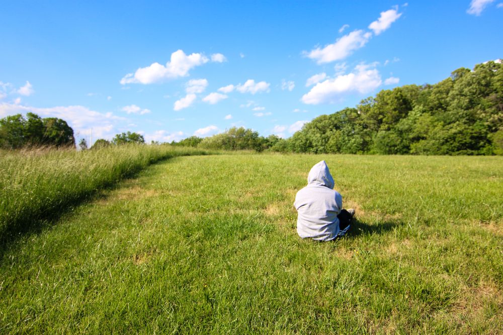 A person on the grounds of Rock Creek Park