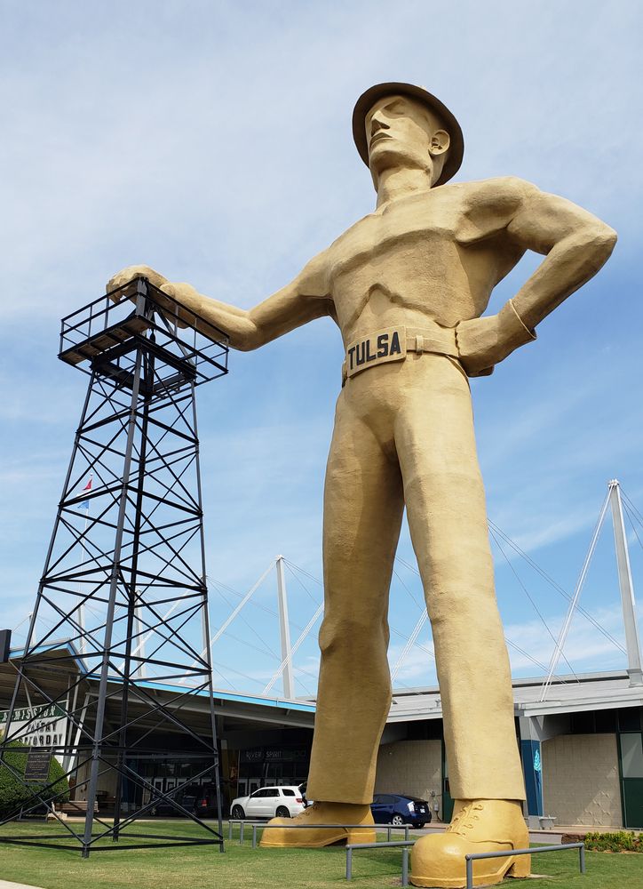 Daytime view of the tall Golden Driller Statue