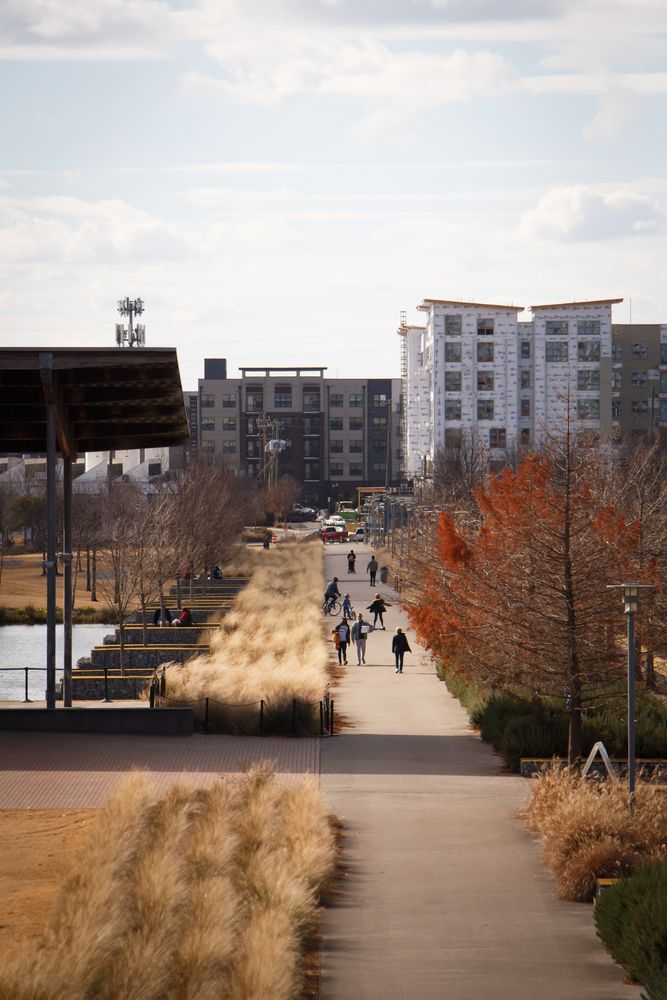 People walking along Birmingham Railroad Park