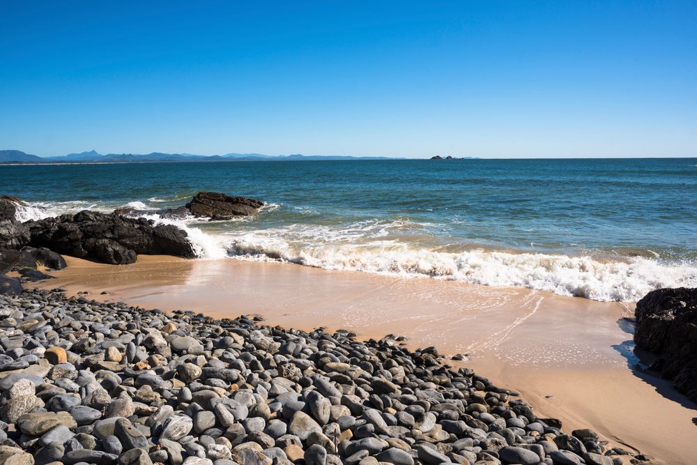 Rocky shore of Little Wategos beach