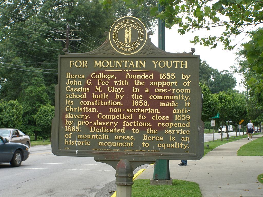 Berea college sign post with the history of the college written on it.
